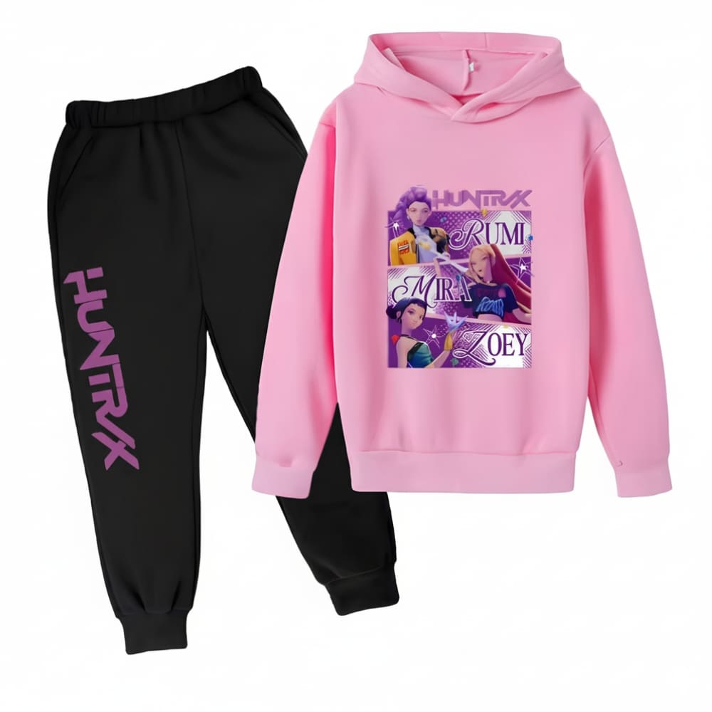 K-pop Demon Hunters two-tone tracksuit with black trousers featuring Huntrix lettering and a pink hoodie with character print of the three heroines, on a white background.