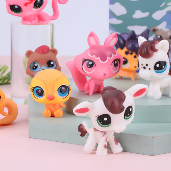 Close-up of the Littlest Pet Shop style Advent Calendar box showing the blue Christmas tree design and some of the 24 included animal figurines.