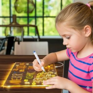 Young girl drawing glowing neon letters and colourful patterns on a reusable LED light-up drawing board placed on a table.