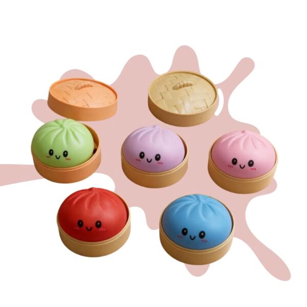Set of 5 Kawaii Anti-Stress Squishy Dumplings – Steamed Bun Shapes Five pastel-coloured boxes each containing a kawaii dumpling squishy in a steamed bun shape, every box in a different vibrant colour.